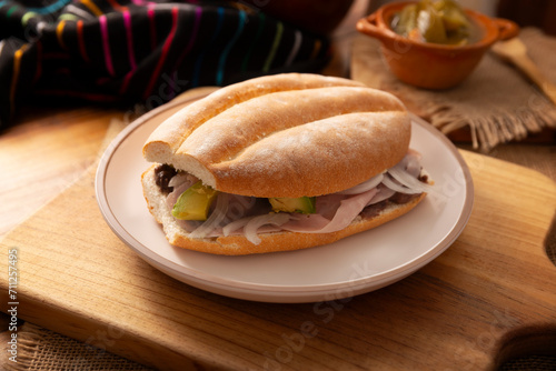 Mexican ham sandwich, in Mexico it is called Torta de Jamon, it is the most popular of the Mexican Tortas and the recipe varies depending on who prepares it, made with bolillo o telera bread. photo