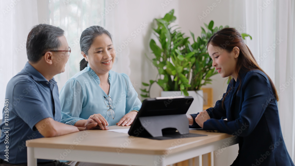 Financial advisor,realtor agent,insurance,lawyer,Manage your retirement fund concept.Financial advisor showing presentation on computer,deal shake hand to happiness Elderly asian couple retirement