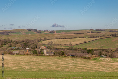 Photography A rural Sussex landscape on a sunny day in January, with Falmer Village nestled