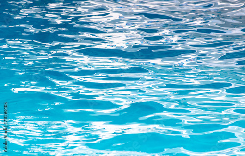 Blue water in the pool as an abstract background. Texture