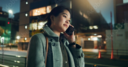 Asian woman, phone call and laughing at night in city for funny joke, conversation or outdoor travel. Happy female person smile and talking on mobile smartphone in late evening for discussion in town