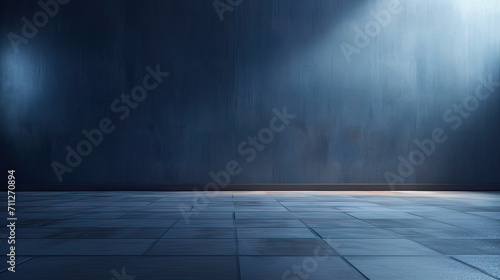 A dark room with a concrete floor and a spotlight. Suitable for dramatic or mysterious themed designs  theater and event promotion  and creative storytelling visuals. empty dark blue room