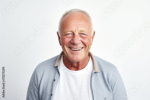 Portrait of a happy senior man smiling at the camera on white background