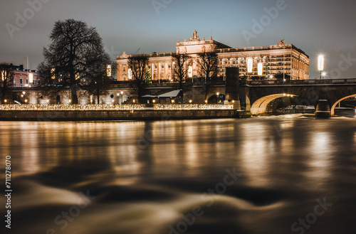 Royal palace lit up at night with river, Stockholm Sweden photo