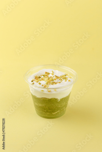 Tableau sur toile dessert with cream cheese and pistachios in a clear glass