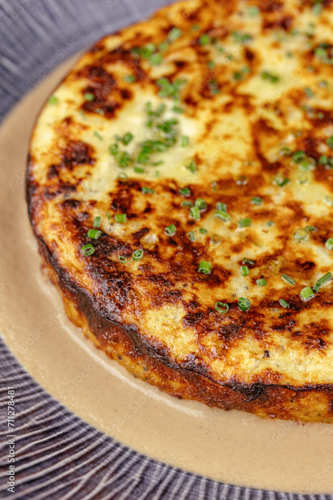 baked omelet with vegetables on a plate baked omelet with vegetables on a plate