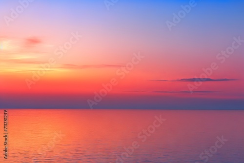 Beautiful sunset colors over the ocean with fluffy clouds © Ameer