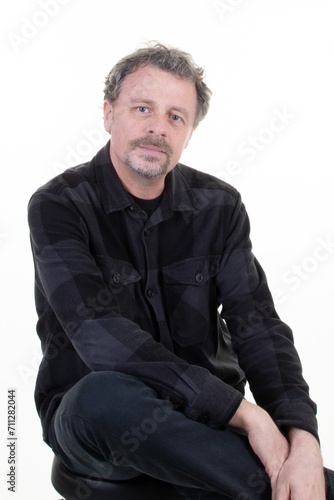 Mature man middle aged handsome isolated over white background © OceanProd