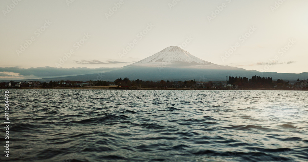 Mountain, nature and landscape with sea, sky and calm horizon on holiday or vacation. Fujiyoshida, Japan and skyline with trees in summer environment with ocean, water or waves on river shoreline