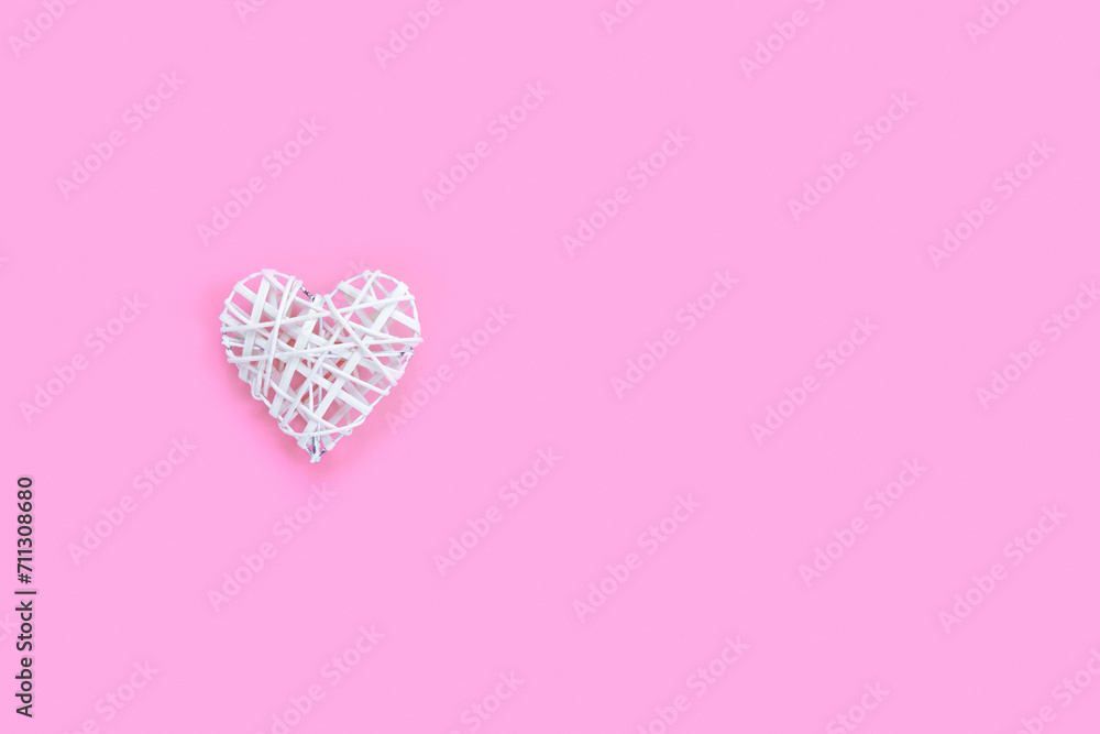Beautiful heart on pink paper background for Valentine's day. Creative greeting card.