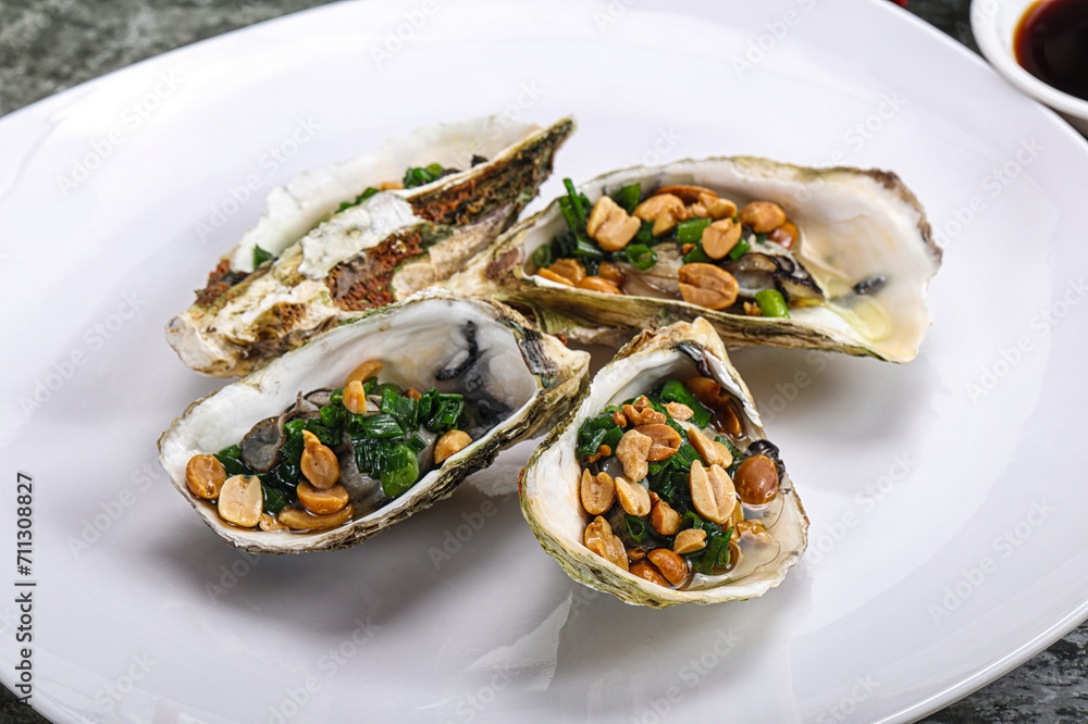 Open half oysters with green onion Open half oysters with green onion