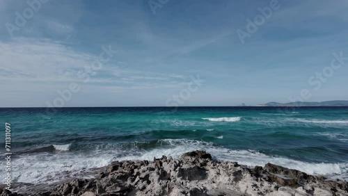 Crystal-clear Sea of Formentera with Ibiza s Es Vedra in Background photo