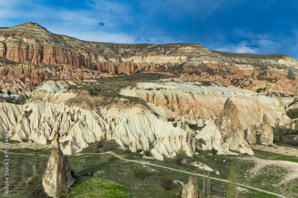 Typical Cappadocia landscape soft volcanic rock, shaped by erosion in Goreme, Turkey.