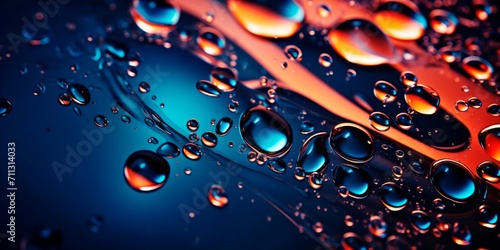 Close-up of liquid, drops and bubbles in red and blue to decorate a poster, booklet cover. Abstract background. photo