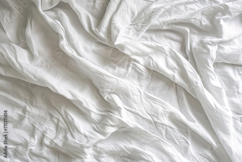 a white blanket with a white design on the bottom
