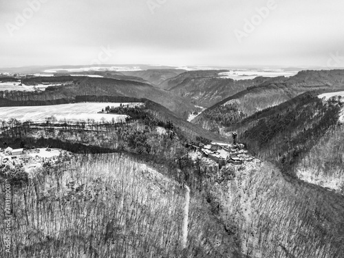 aerial view rock with medieval castle Ehrenburg near moselle river Brodenbach white winter snow wonderland forest hills photo