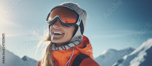 girl in winter snowboarding clothes rides on the slope with a smile