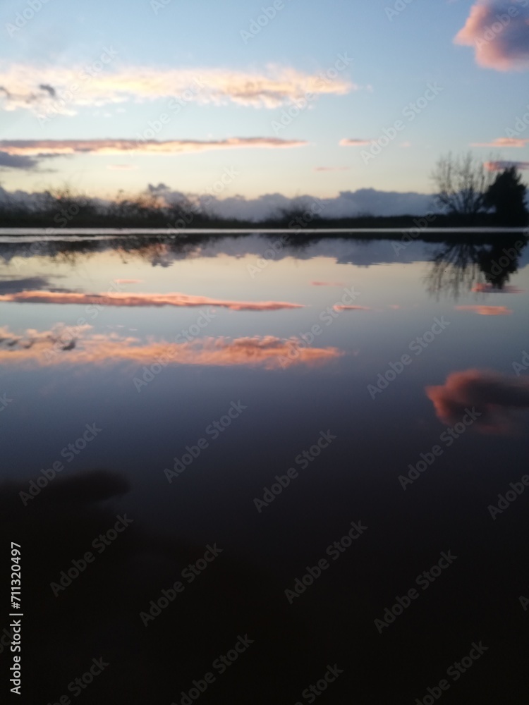 Fototapeta premium Reflection of sunset on a pond.