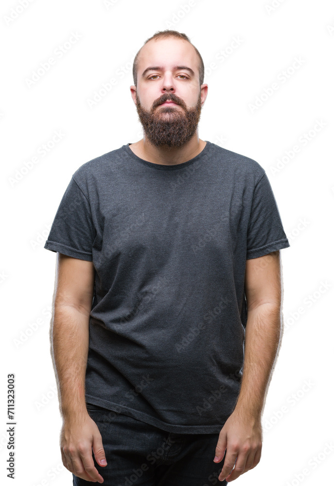 Young caucasian hipster man over isolated background with serious expression on face. Simple and natural looking at the camera. Young caucasian hipster man over isolated background with serious expression on face. Simple and natural looking at the camera.