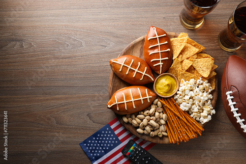 A bowl with various snacks, a remote control and an American flag photo