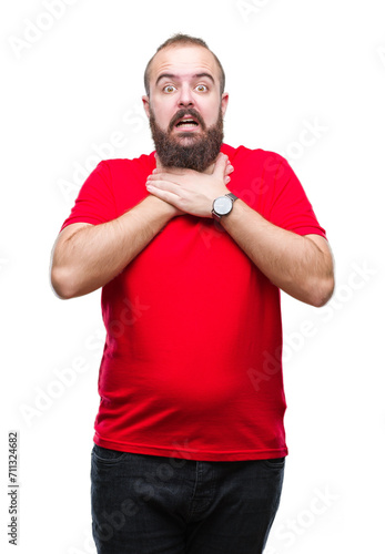 Young caucasian hipster man wearing red shirt over isolated background shouting and suffocate because painful strangle. Health problem. Asphyxiate and suicide concept.