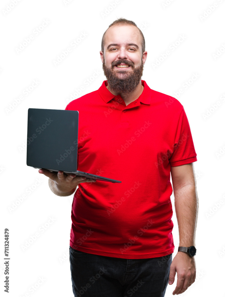 Young caucasian man using computer laptop over isolated background with a happy face standing and smiling with a confident smile showing teeth Young caucasian man using computer laptop over isolated background with a happy face standing and smiling with a confident smile showing teeth