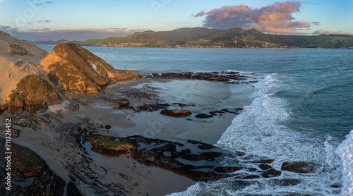 The Hokianga Harbour and giant sand dunes at sunset. Opononi, Northland, New Zealand. photo