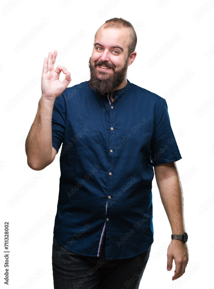 Young caucasian hipster man over isolated background smiling positive doing ok sign with hand and fingers. Successful expression. Young caucasian hipster man over isolated background smiling positive doing ok sign with hand and fingers. Successful expression.