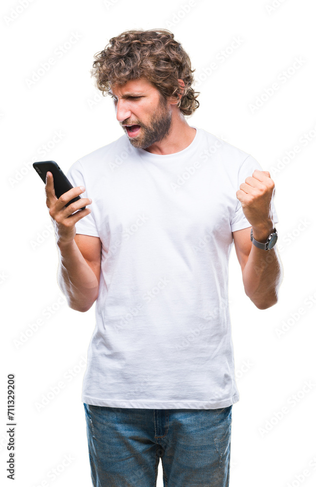 Handsome hispanic man model sending message texting using smartphone over isolated background screaming proud and celebrating victory and success very excited, cheering emotion Handsome hispanic man model sending message texting using smartphone over isolated background screaming proud and celebrating victory and success very excited, cheering emotion