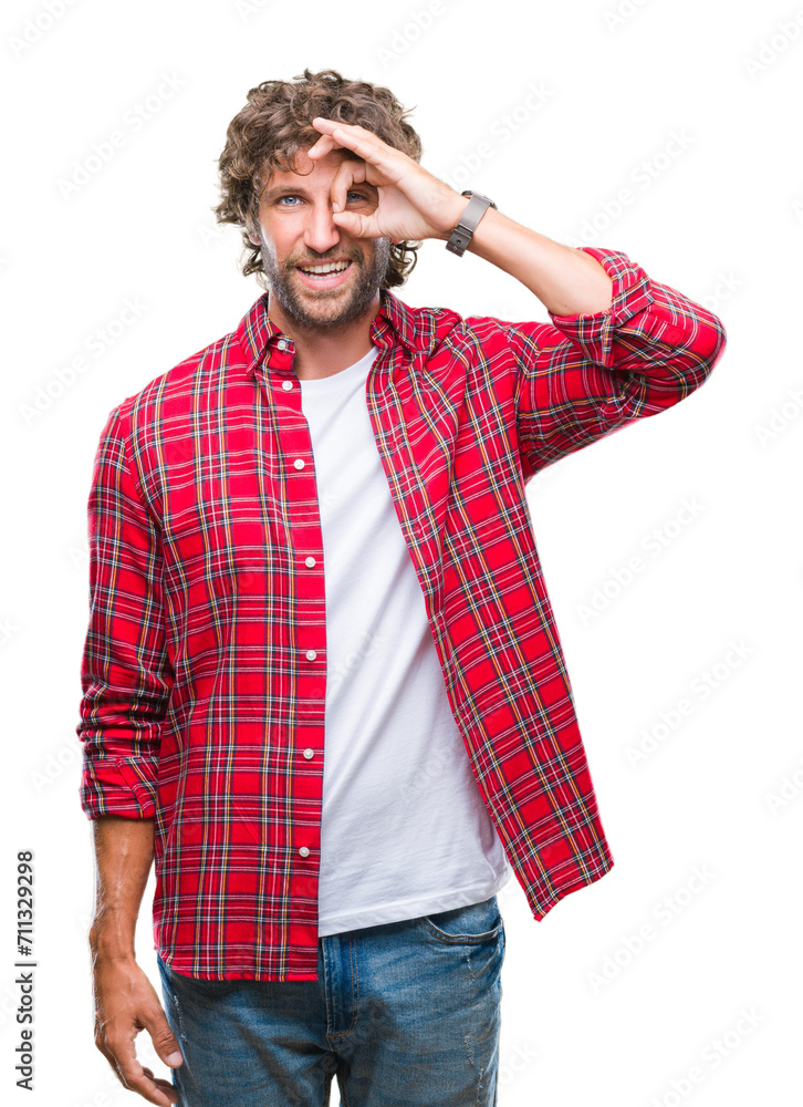 Handsome hispanic model man over isolated background doing ok gesture with hand smiling, eye looking through fingers with happy face. Handsome hispanic model man over isolated background doing ok gesture with hand smiling, eye looking through fingers with happy face.