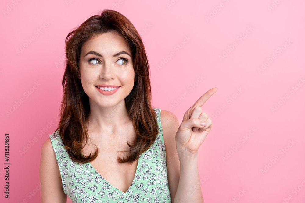 Portrait of adorable cute girl wear stylish print outfit presenting brand novelty empty space isolated on pink color background Portrait of adorable cute girl wear stylish print outfit presenting brand novelty empty space isolated on pink color background