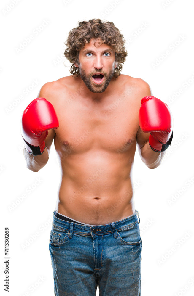 Handsome hispanic boxer man wearing boxing gloves over isolated background scared in shock with a surprise face, afraid and excited with fear expression