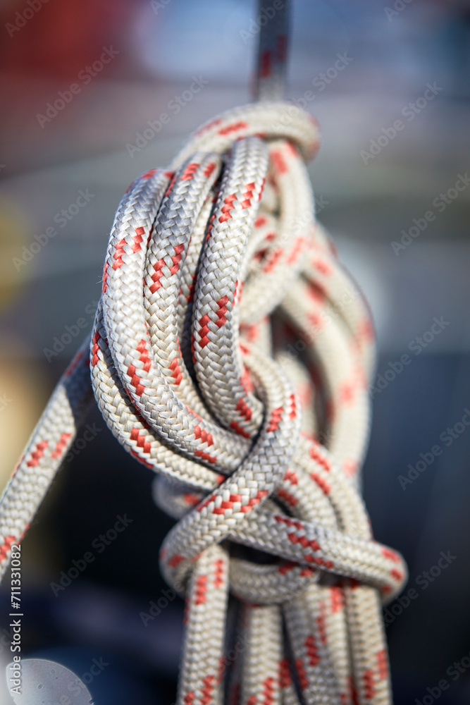 Detail of a mooring rope placed on sailing boat yacht desk Detail of a mooring rope placed on sailing boat yacht desk