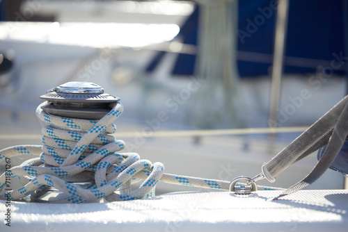 Detail of a mooring rope placed on sailing boat yacht desk © fox17