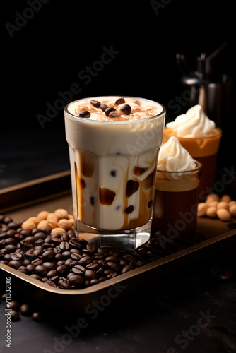 Iced coffee, whipped cream, and coffee beans set on the tray