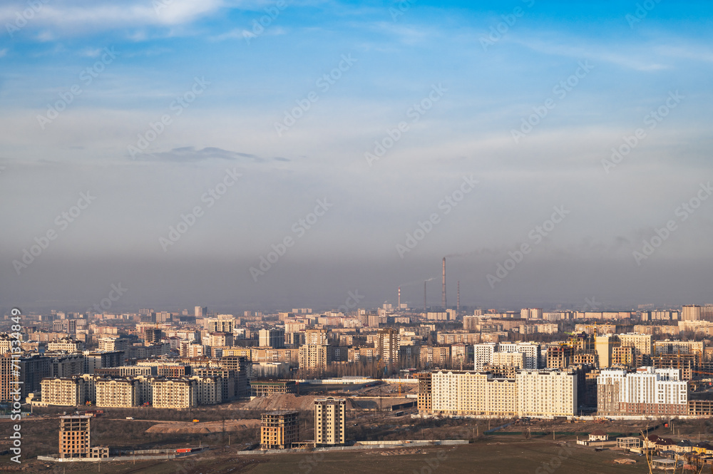 Panorama of the city of the capital of Kyrgyzstan, Bishkek. Smog over the city.
