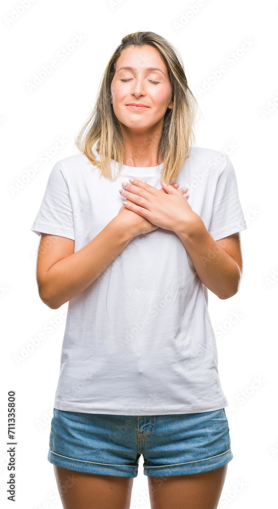 Young beautiful woman over isolated background smiling with hands on chest with closed eyes and grateful gesture on face. Health concept. Young beautiful woman over isolated background smiling with hands on chest with closed eyes and grateful gesture on face. Health concept.