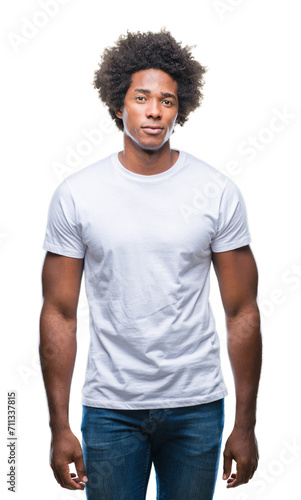 Afro american man over isolated background with serious expression on face. Simple and natural looking at the camera.