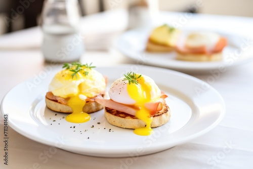 toasted english muffins with poached eggs and hollandaise sauce