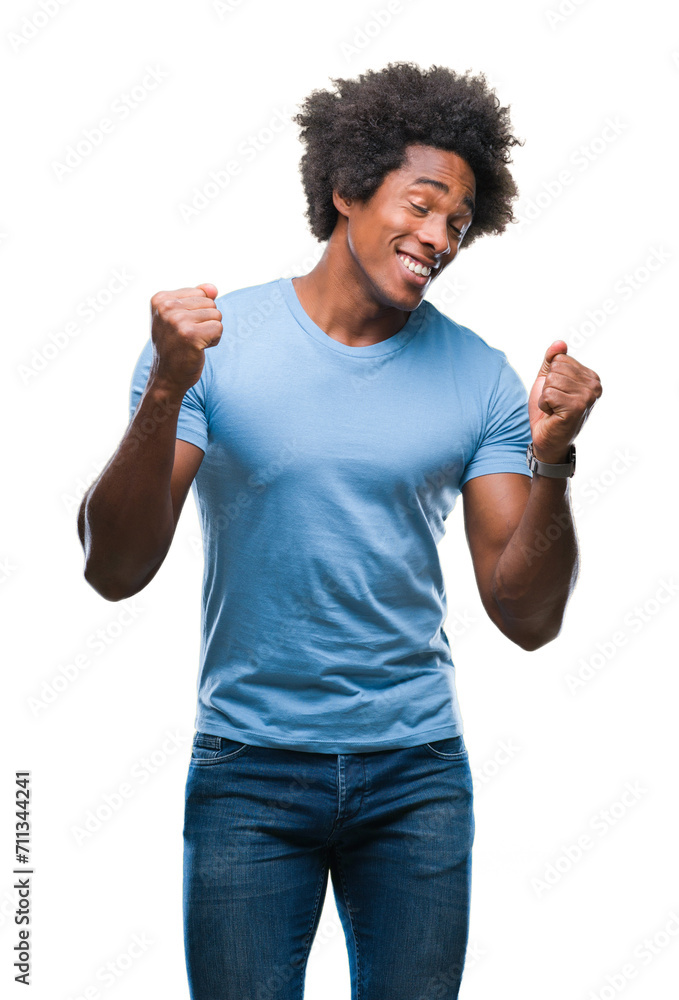 Afro american man over isolated background very happy and excited doing winner gesture with arms raised, smiling and screaming for success. Celebration concept. Afro american man over isolated background very happy and excited doing winner gesture with arms raised, smiling and screaming for success. Celebration concept.
