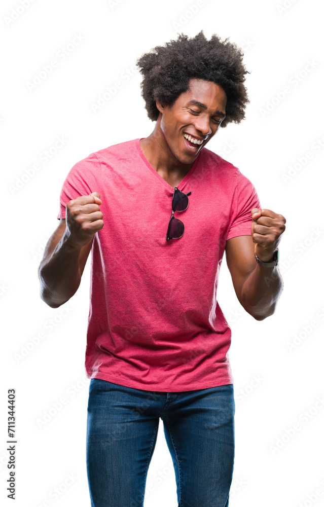 Afro american man over isolated background very happy and excited doing winner gesture with arms raised, smiling and screaming for success. Celebration concept. Afro american man over isolated background very happy and excited doing winner gesture with arms raised, smiling and screaming for success. Celebration concept.