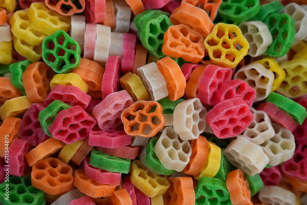 Close-up of a vibrant assortment of ring-shaped fryums