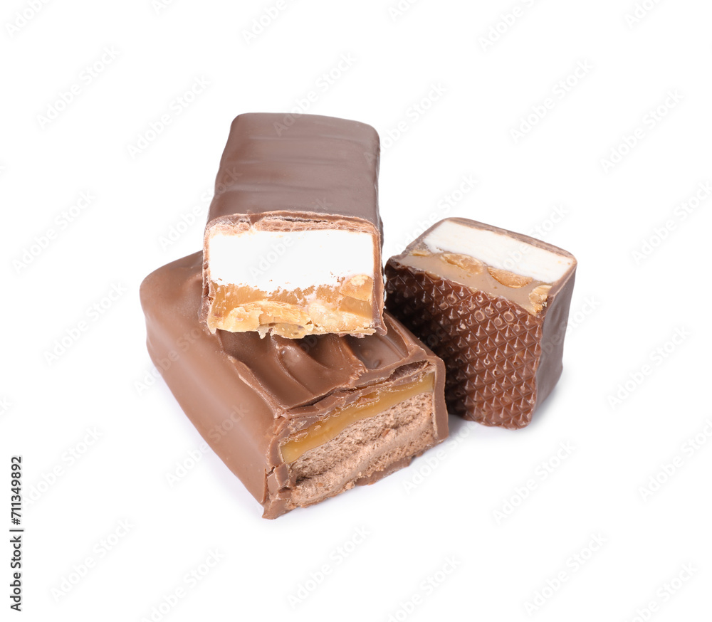 Pieces of tasty chocolate bars with nougat and nuts on white background Pieces of tasty chocolate bars with nougat and nuts on white background