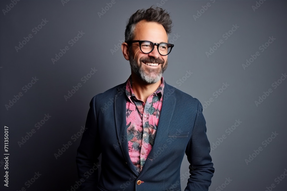 Handsome middle aged man wearing a suit and glasses. Studio shot. Handsome middle aged man wearing a suit and glasses. Studio shot.