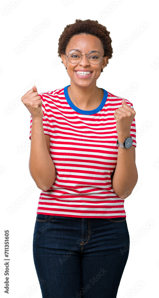 Beautiful young african american woman wearing glasses over isolated background celebrating surprised and amazed for success with arms raised and open eyes. Winner concept. Beautiful young african american woman wearing glasses over isolated background celebrating surprised and amazed for success with arms raised and open eyes. Winner concept.