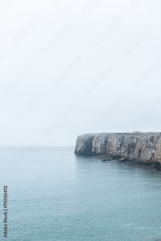 Dramatic cliffs in fog at Atlantic Ocean, Sagres, Algarve, Portugal Dramatic cliffs in fog at Atlantic Ocean, Sagres, Algarve, Portugal