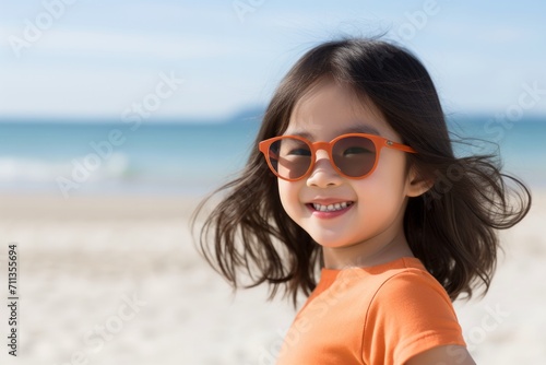 Asian child Girl at Beach in a sunny day