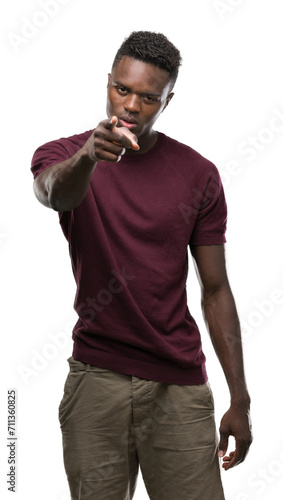 Young african american man pointing with finger to the camera and to you, hand sign, positive and confident gesture from the front