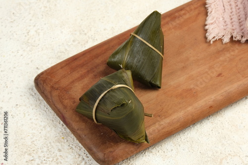 Zongzi or Bakcang or Bacang.Chinese Savoury Sticky Rice Dumplings .Traditional Chinese Food.Eat at Dragon Boat Festival, Peh Cun, Imlek and Lunar photo