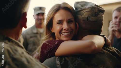 Joyful reunion as woman embraces military man returning home. Military family embrace.
